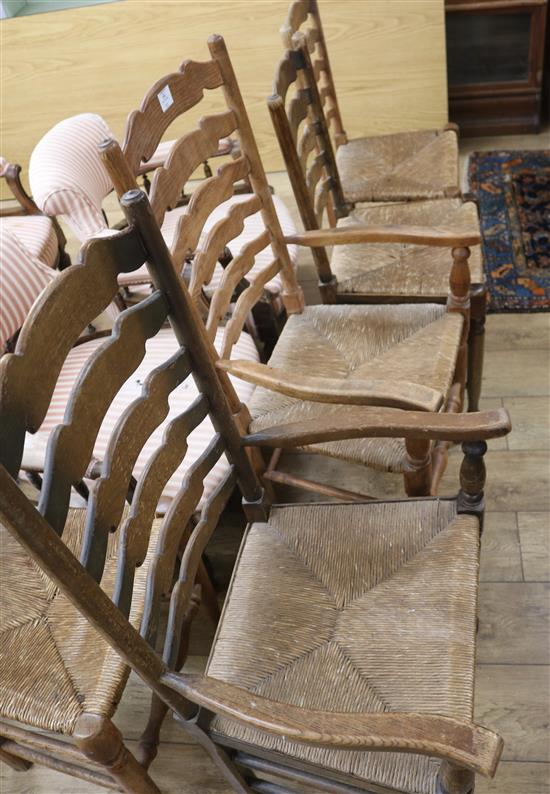 A set of five ash ladderback, rush seated dining chairs